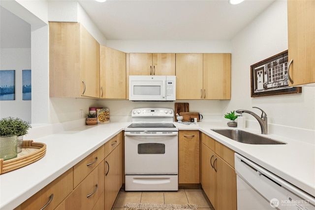 150 Melrose Ave E Unit 105, Seattle, WA 98102 - kitchen featuring white appliances, light countertops, light brown cabinetry, and light tile patterned floors