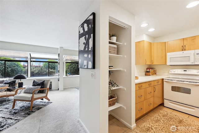 150 Melrose Ave E Unit 105, Seattle, WA 98102 - kitchen featuring white appliances, light brown cabinets, light countertops, and recessed lighting