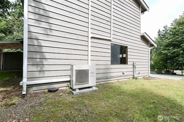 1264 SW Lanyard Loop Unit 2, Oak Harbor, WA 98277 - view of side of home with an ac unit and a lawn