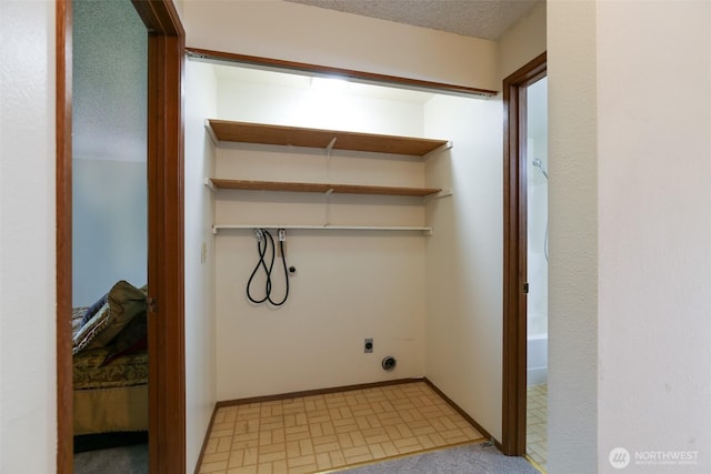 1264 SW Lanyard Loop Unit 2, Oak Harbor, WA 98277 - laundry area with hookup for an electric dryer and a textured ceiling