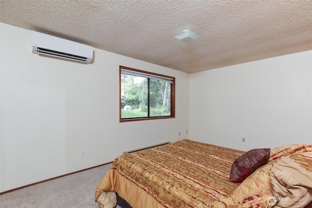 1264 SW Lanyard Loop Unit 2, Oak Harbor, WA 98277 - carpeted bedroom featuring a wall mounted air conditioner and a textured ceiling
