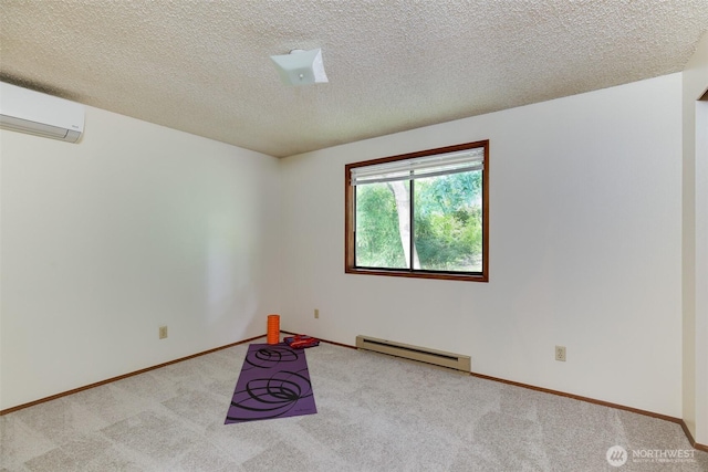 1264 SW Lanyard Loop Unit 2, Oak Harbor, WA 98277 - carpeted spare room featuring a baseboard radiator, an AC wall unit, and a textured ceiling