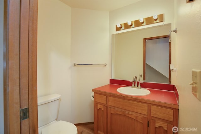 1264 SW Lanyard Loop Unit 2, Oak Harbor, WA 98277 - half bathroom featuring vanity and wood finished floors