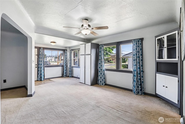 1004 S 5th Ave, Kelso, WA 98626 - unfurnished room with light colored carpet, a ceiling fan, and a textured ceiling