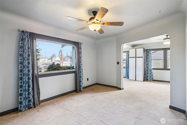 1004 S 5th Ave, Kelso, WA 98626 - carpeted spare room with ceiling fan and arched walkways