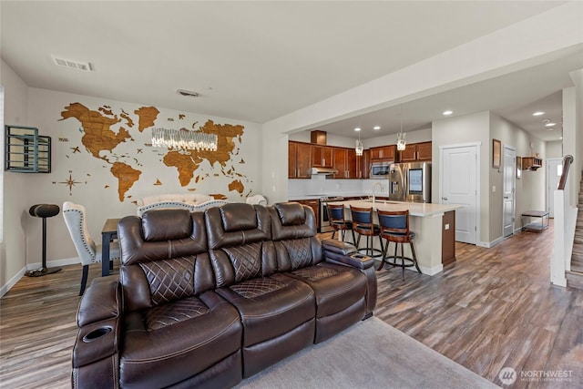 2015 79th St SE, Everett, WA 98203 - living area with dark wood-style floors, recessed lighting, and a chandelier