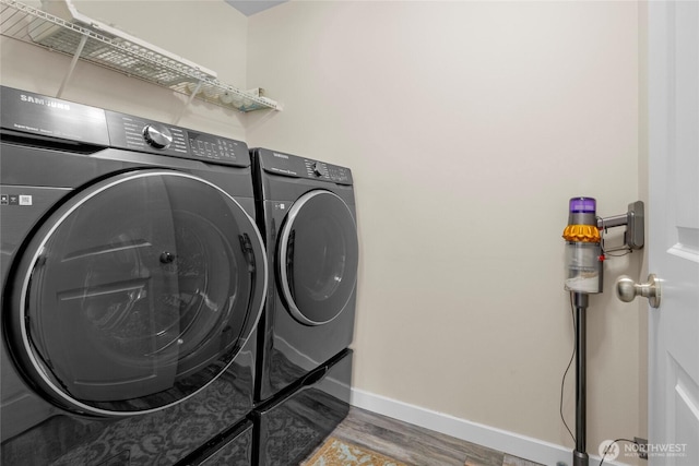 2015 79th St SE, Everett, WA 98203 - washroom with washing machine and clothes dryer and wood finished floors