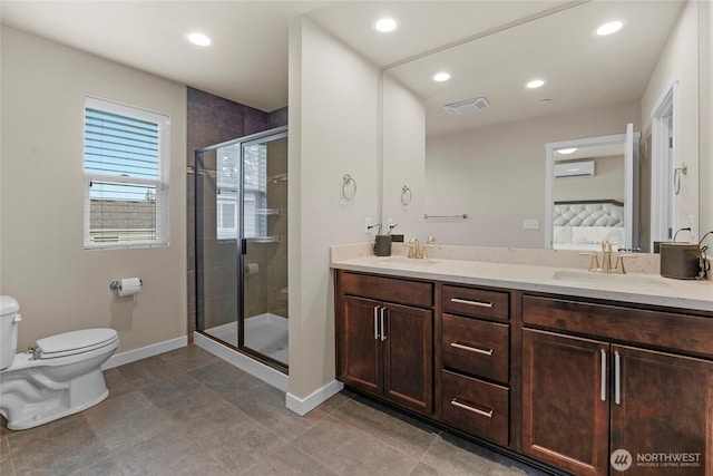 2015 79th St SE, Everett, WA 98203 - bathroom with double vanity, a shower stall, a wall mounted AC, recessed lighting, and tile patterned flooring