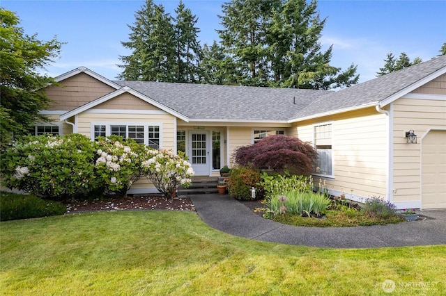 4703 235th St E, Spanaway, WA 98387 - single story home with a front yard, roof with shingles, and an attached garage