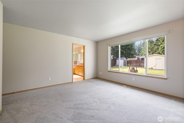 4703 235th St E, Spanaway, WA 98387 - spare room featuring light carpet and baseboards