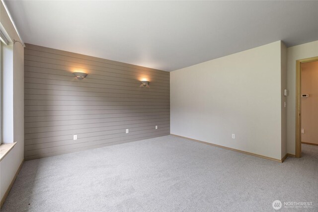 4703 235th St E, Spanaway, WA 98387 - carpeted empty room with wooden walls