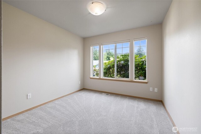 4703 235th St E, Spanaway, WA 98387 - carpeted spare room featuring baseboards