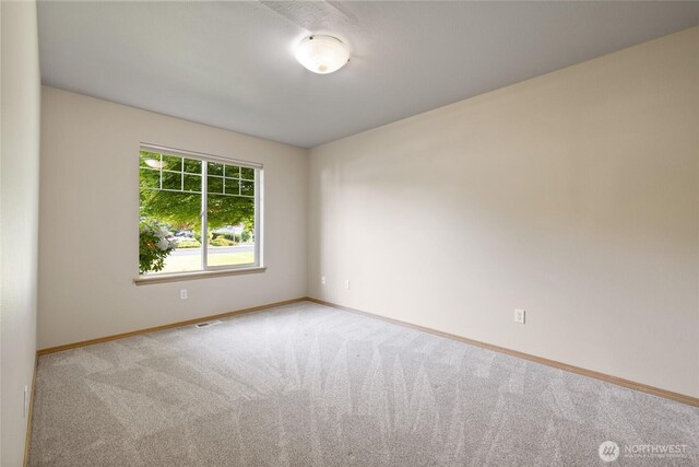 4703 235th St E, Spanaway, WA 98387 - carpeted empty room with baseboards