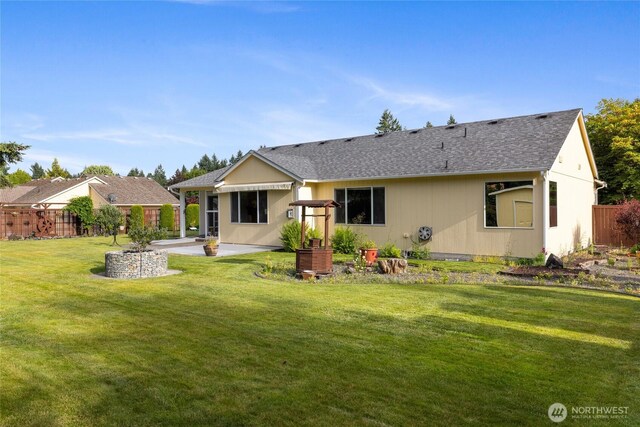 4703 235th St E, Spanaway, WA 98387 - rear view of house with a patio and roof with shingles