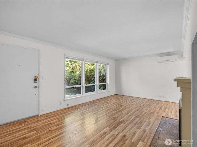 14324 Wayne Pl N, Seattle, WA 98133 - unfurnished living room with light wood finished floors, a wall mounted AC, crown molding, and a fireplace with flush hearth