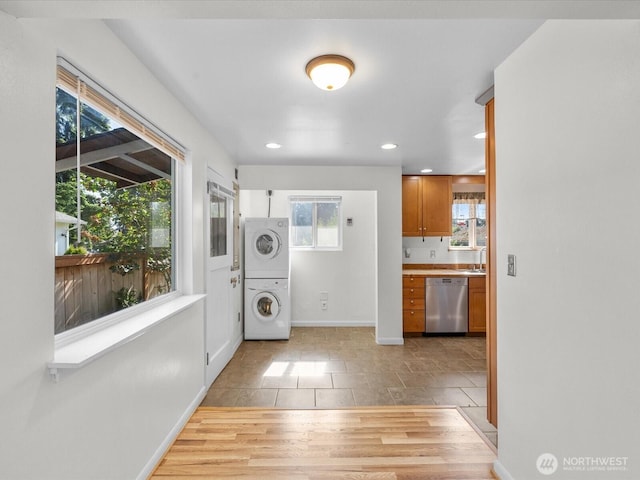 14324 Wayne Pl N, Seattle, WA 98133 - washroom with stacked washer and clothes dryer and recessed lighting