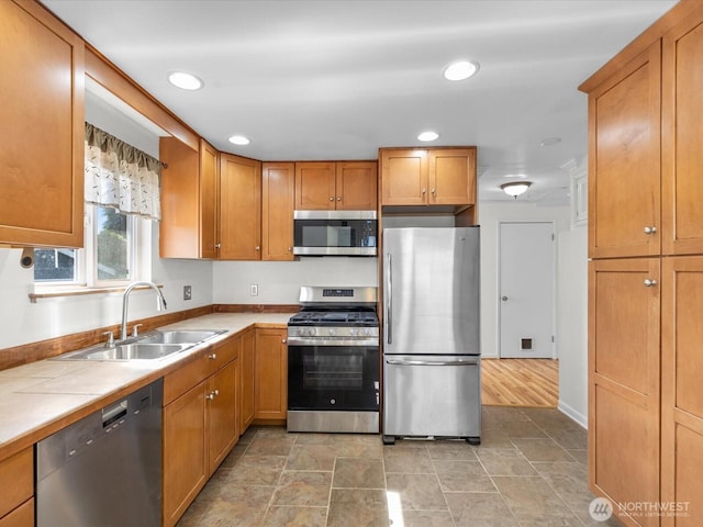 14324 Wayne Pl N, Seattle, WA 98133 - kitchen featuring stainless steel appliances, tile countertops, recessed lighting, and brown cabinetry