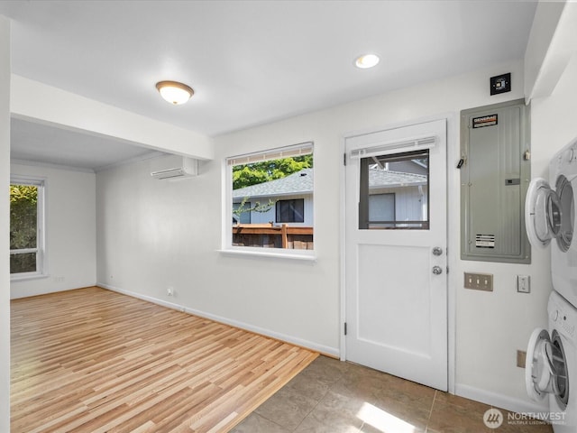 14324 Wayne Pl N, Seattle, WA 98133 - foyer entrance with stacked washer and clothes dryer, a wall mounted air conditioner, electric panel, recessed lighting, and wood finished floors