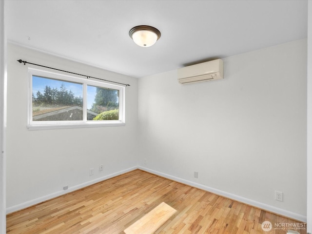 14324 Wayne Pl N, Seattle, WA 98133 - empty room featuring a wall mounted air conditioner and wood finished floors