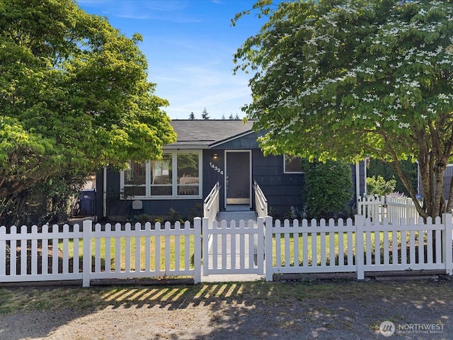 14324 Wayne Pl N, Seattle, WA 98133 - view of property hidden behind natural elements with a fenced front yard and entry steps