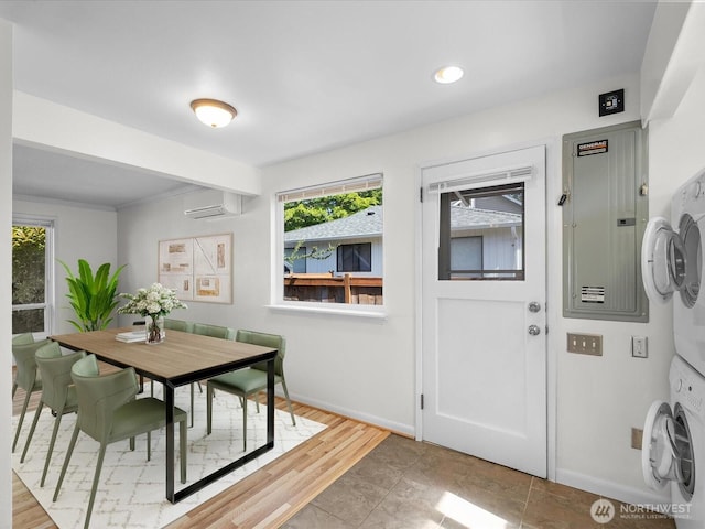 14324 Wayne Pl N, Seattle, WA 98133 - dining room with stacked washer / dryer, a wall mounted AC, plenty of natural light, electric panel, and recessed lighting