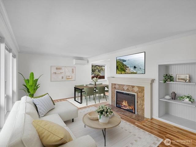 14324 Wayne Pl N, Seattle, WA 98133 - living room with crown molding, a tiled fireplace, wood finished floors, plenty of natural light, and built in features