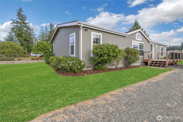 20301 69th St E, Bonney Lake, WA 98391 - view of side of home with a wooden deck, crawl space, and a yard