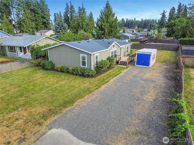 20301 69th St E, Bonney Lake, WA 98391 - view of front of house with a residential view, driveway, and a deck