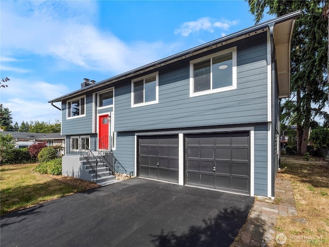 17301 6th Ave E, Spanaway, WA 98387 - raised ranch with a garage, a chimney, and asphalt driveway