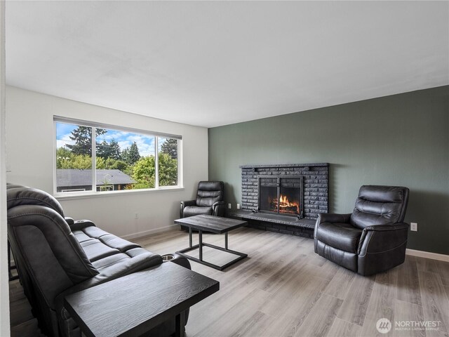 17301 6th Ave E, Spanaway, WA 98387 - living room with a fireplace and light wood-style flooring