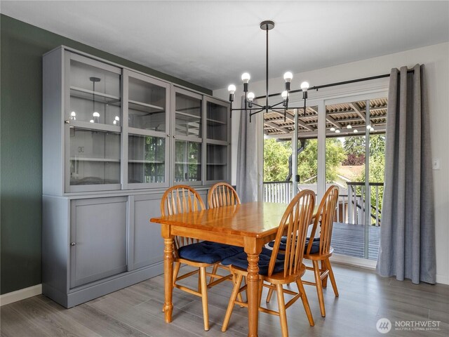 17301 6th Ave E, Spanaway, WA 98387 - dining area with a chandelier and wood finished floors