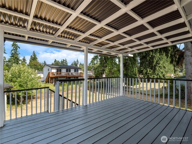17301 6th Ave E, Spanaway, WA 98387 - wooden terrace featuring a lawn and view of scattered trees