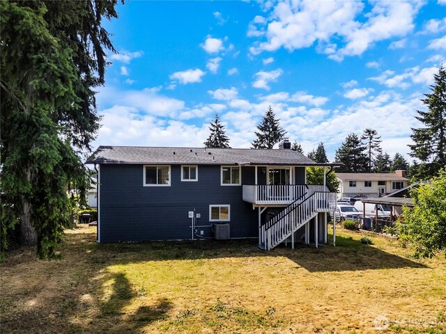 17301 6th Ave E, Spanaway, WA 98387 - rear view of house with a lawn, stairs, and a deck