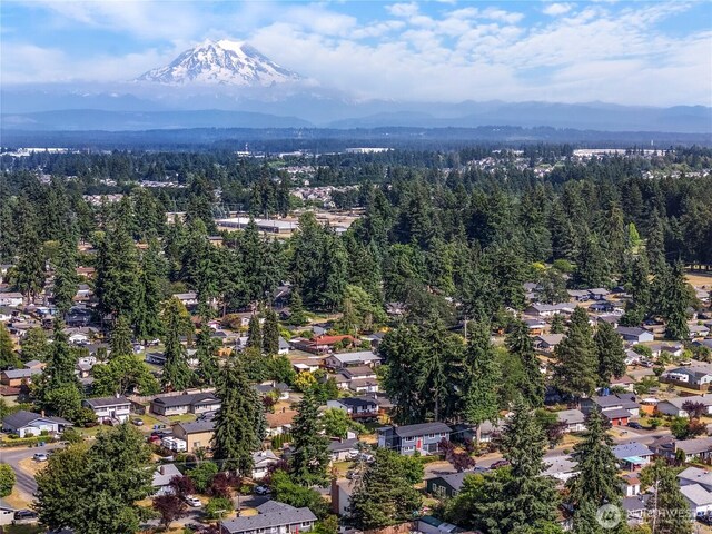 17301 6th Ave E, Spanaway, WA 98387 - aerial perspective of suburban area featuring a mountainous background