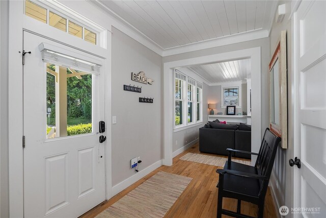 173 Meriweather St, Pacific Beach, WA 98571 - entrance foyer featuring crown molding, light wood-style floors, and wooden ceiling