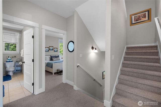 173 Meriweather St, Pacific Beach, WA 98571 - stairway with healthy amount of natural light, carpet floors, and tile patterned floors