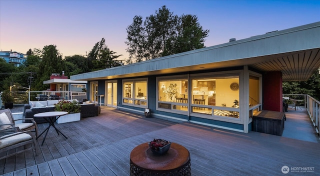 1730 Taylor Ave N Unit 502, Seattle, WA 98109 - deck at dusk featuring outdoor lounge area