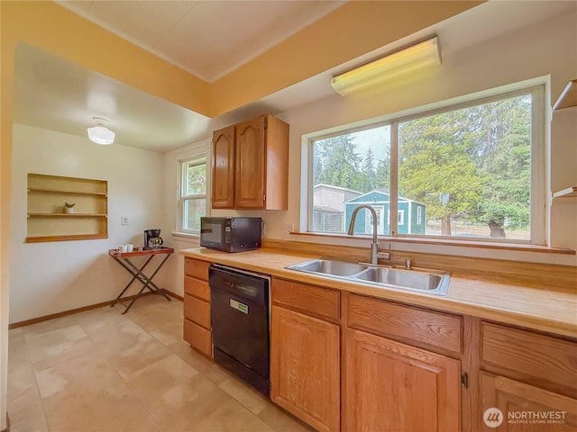 5302 Rockefeller Ave, Everett, WA 98203 - kitchen with black appliances, light countertops, and light tile patterned flooring