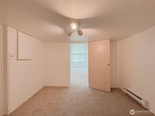 5302 Rockefeller Ave, Everett, WA 98203 - unfurnished room with a baseboard heating unit and light carpet