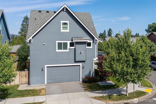 795 NE 2nd St, North Bend, WA 98045 - view of property exterior featuring a shingled roof, driveway, and an attached garage