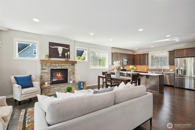 795 NE 2nd St, North Bend, WA 98045 - living area featuring healthy amount of natural light, a fireplace, recessed lighting, and dark wood-type flooring