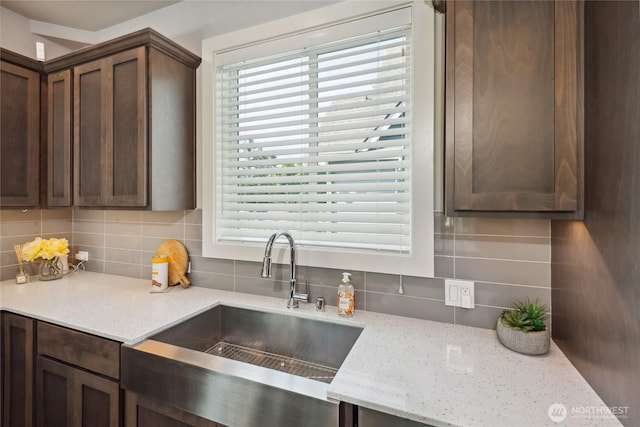795 NE 2nd St, North Bend, WA 98045 - kitchen featuring tasteful backsplash, plenty of natural light, and light stone countertops