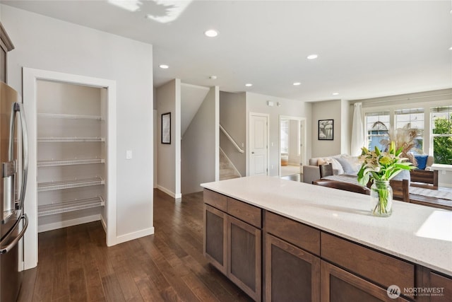 795 NE 2nd St, North Bend, WA 98045 - kitchen with stainless steel refrigerator with ice dispenser, dark wood-style floors, light stone counters, open floor plan, and recessed lighting