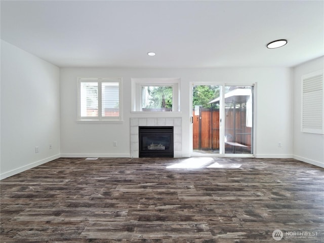 10105 6th Dr SE Unit B, Everett, WA 98208 - unfurnished living room featuring dark wood-style floors, healthy amount of natural light, a fireplace, and recessed lighting
