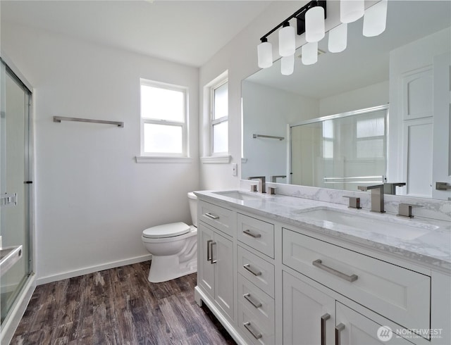 10105 6th Dr SE Unit B, Everett, WA 98208 - full bathroom featuring a stall shower, double vanity, and wood finished floors