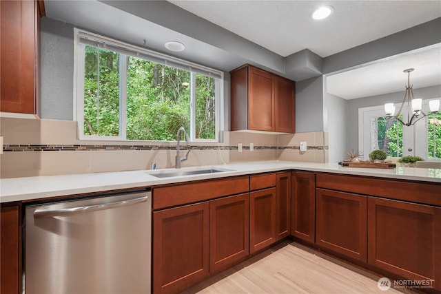 13719 Pinehurst Ln NW, Gig Harbor, WA 98329 - kitchen with dishwasher, light countertops, backsplash, light wood-style flooring, and recessed lighting