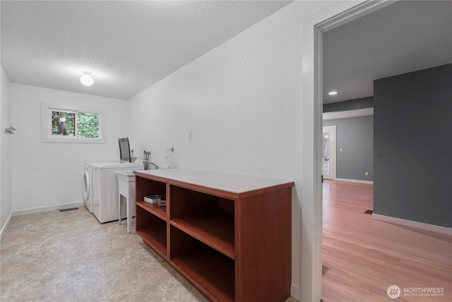 13719 Pinehurst Ln NW, Gig Harbor, WA 98329 - washroom with washer and clothes dryer and a textured ceiling