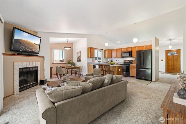21850 SE 271st Pl, Maple Valley, WA 98038 - living room with light colored carpet, lofted ceiling, and a fireplace