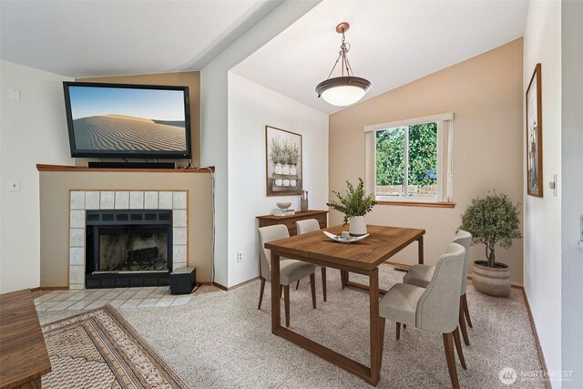 21850 SE 271st Pl, Maple Valley, WA 98038 - dining area featuring vaulted ceiling and a tiled fireplace