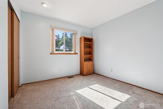 21850 SE 271st Pl, Maple Valley, WA 98038 - unfurnished bedroom featuring carpet and a closet